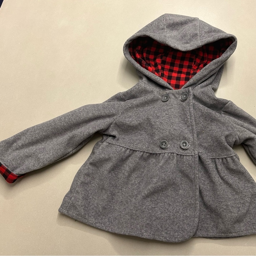 Carters grey pea style jacket with black/red detailing on sleeves and hood